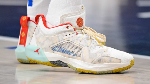 View of tan and red Air Jordan shoes.